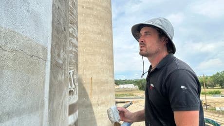 An Australian artist is creating a massive mural in the middle of a small North Dakota town