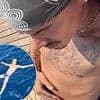 Shirtless Romeo Beckham and his brother strip down to their swimwear with Cruz slipping back into his Speedos in latest snaps from their fun-filled family holiday in Italy