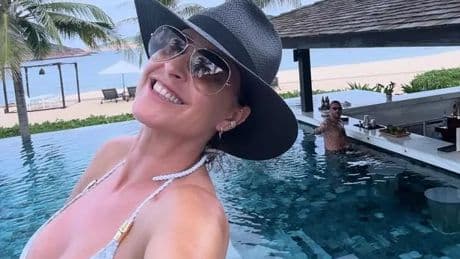 Lisa Snowdon shows off toned figure as she practices yoga in just a bikini