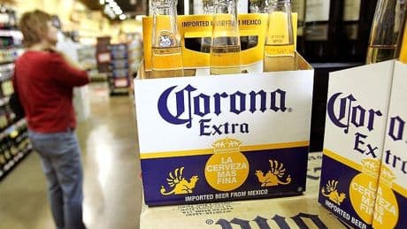 Corona's owner says beer sales have slowed because one major customer group isn't buying beer like it used to