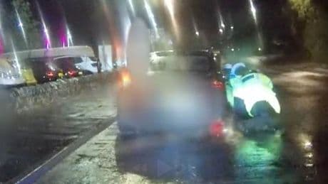 Horrific moment mum drags two cops down road after speeding off during traffic stop – as she’s jailed