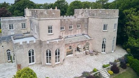 UK castle that costs less than a hotel stay in London with indoor swimming pool, tropical gardens and private beach