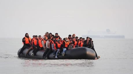 Hundreds of migrants cross Channel in small boats