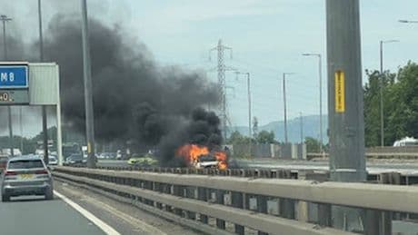 Car bursts into flames on M8 as firefighters battle to control blaze