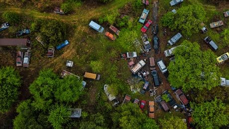 I stumbled across a luxury car graveyard where Cadillacs & Chevys rot after owner abandoned hundreds of vintage vehicles