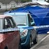 Man arrested after death of woman found injured on street