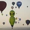 Up, up and away! Skies above Bristol fill with dinosaurs, aliens and cows for annual balloon festival