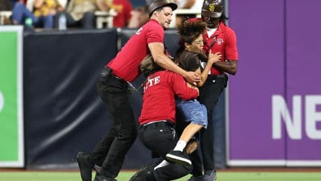 Young kid tackled by Padres security after invading field — and fans were not happy