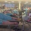 Brits are left stranded in 'war zone' conditions for 17 hours after 'drunk' couple are caught smoking on Mexico-London flight and force plane to divert