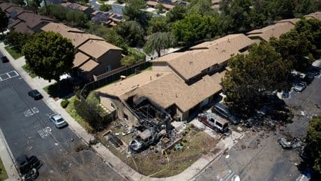 AP PHOTOS: Jet crashes into San Diego neighborhood, killing 3 and setting homes and vehicles on fire