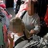 Moment brazen shoplifters stuff £100 of kids' clothes into rucksack from independent children's boutique