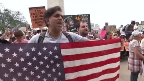 US: Thousands of protesters rally against Donald Trump across the country