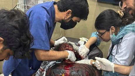 The Latest: India fires missiles across the border with Pakistan, killing at least 1, officials say