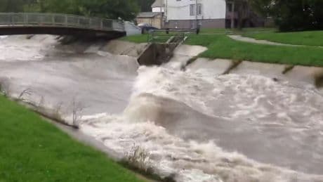 Torrential Midwest flash floods turn state fair into water park and shut airports and roads with more to come