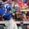 Springer goes deep twice as Blue Jays hold off Reds, 12-9