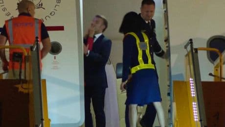 Macron says he and wife were horsing around when she appears to push the French leader