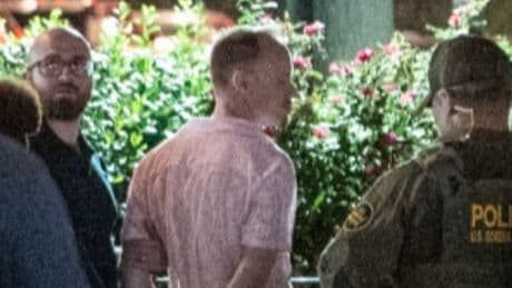 Suspect who admitted to hurling sandwich at DC cops on the street revealed to be a Justice Department employee