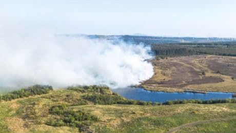 Fire crews still battling huge wildfire in West Lothian as helicopter used to drop water