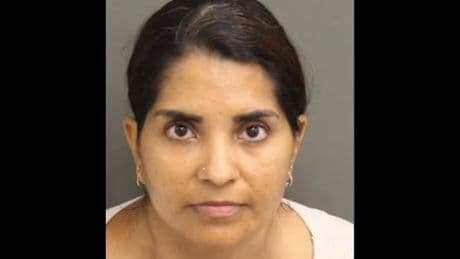 Disney mom faces child abuse charge after she allegedly grabbed a teen in a fight as crowd gathered to watch Magic Kingdom parade