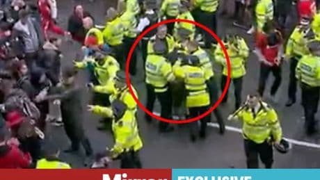 Moment Liverpool driver 'carried away' by ring of cops through panicked crowd