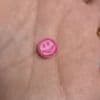 I couldn't figure out why I had a small pink smiley face in my washing machine... but there's a simple answer