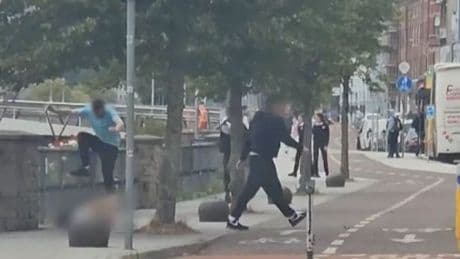 Man beaten and stripped of his clothes in savage street attack in broad daylight