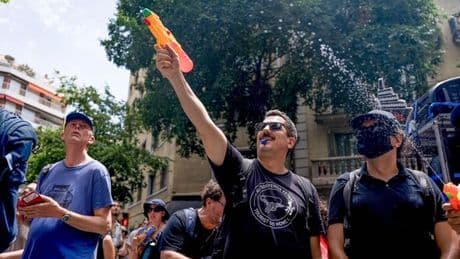 Tourists get last laugh as angry Spanish locals fire water pistols at them