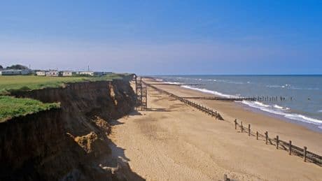 Pretty English seaside village with secluded beach that could disappear in 25 years