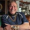 Darts legend, 79, reveals he keeps an amputated body part in a bottle of VODKA behind the bar of his 18-bedroom Essex mansion