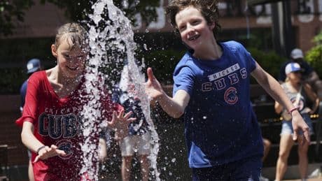 Sports play through another dangerously hot day in parts of the U.S.