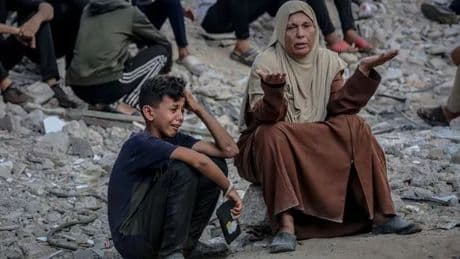 Heartbreaking images as Gaza families mourn people killed queuing for aid