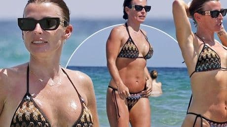 Coleen Rooney turns heads in tiny bikini as she jets off to Ibiza with Wayne