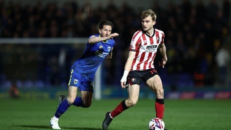 AFC Wimbledon's Sam Hutchinson undergoes surgery after suffering 'complications' during game