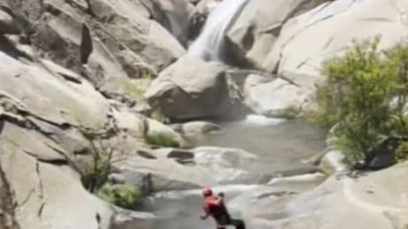 Missing man found ALIVE after spending two days on cliff trapped behind waterfall
