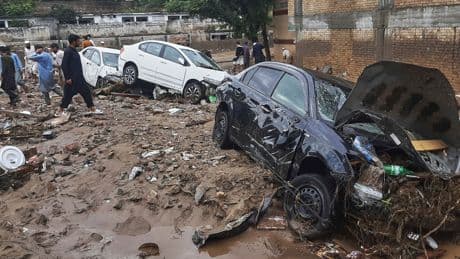 Mass funerals held after more than 300 die in floods across India and Pakistan