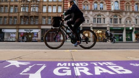 Purple pavement markings part of Mind the Grab campaign to tackle phone theft