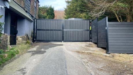 Family ordered to tear down giant metal gate blocking popular path after battle with villagers sparked huge protest