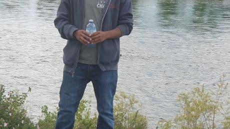 1 year after B.C. shopkeeper set on fire, new police plea in hunt for suspect