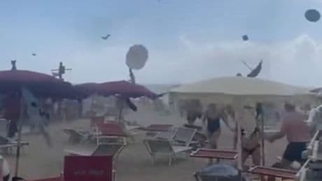 Tourists flee as tornado hits Italian beach, sending parasols flying
