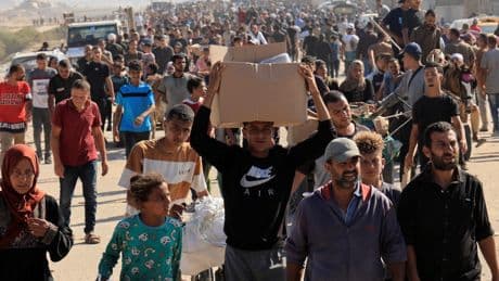 Chaos at Gaza aid site as thousands rush for food and Israeli troops fire warning shots