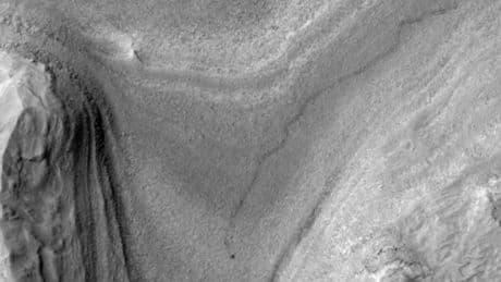 First-of-its-kind Nasa image shows mysterious dark object CRAWLING for 1,000 feet across Mars – can you tell what it is?