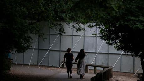 Huge steel fences erected to stop ticketless fans from watching Oasis concert