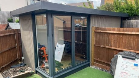 Couple locked in neighbour row ordered to tear down home gym as war over parking spaces erupts… they say ‘it’s not us’