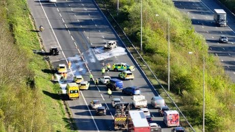 Travel chaos as key motorway CLOSED after horror fireball crash involving two cars with woman rushed to hospital