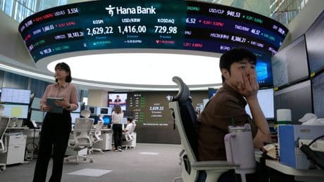 Asian shares mostly gain amid cautious relief over U.S.-China agreement