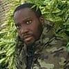 Fugitive caught at Notting Hill Carnival a month after murdering his ex-girlfriend's bus driver father in 'merciless' knife attack is jailed for 29 years