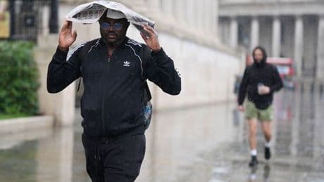 Summer is OVER! Fuming Brits battered by torrential rain and thunderstorms in staggering scenes