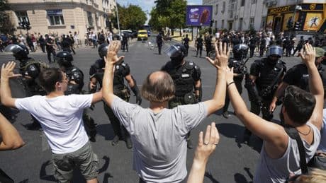 Serbian police remove barricades in Belgrade and make new arrests as protesters block roads