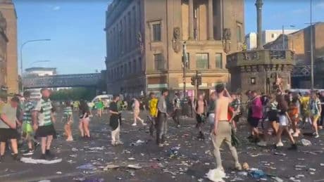 Celtic fans fight in the streets during title party as Glasgow’s Trongate left strewn with litter