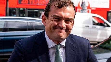Tory MP Patrick Spencer grins outside court as he faces Groucho Club sex assault charges